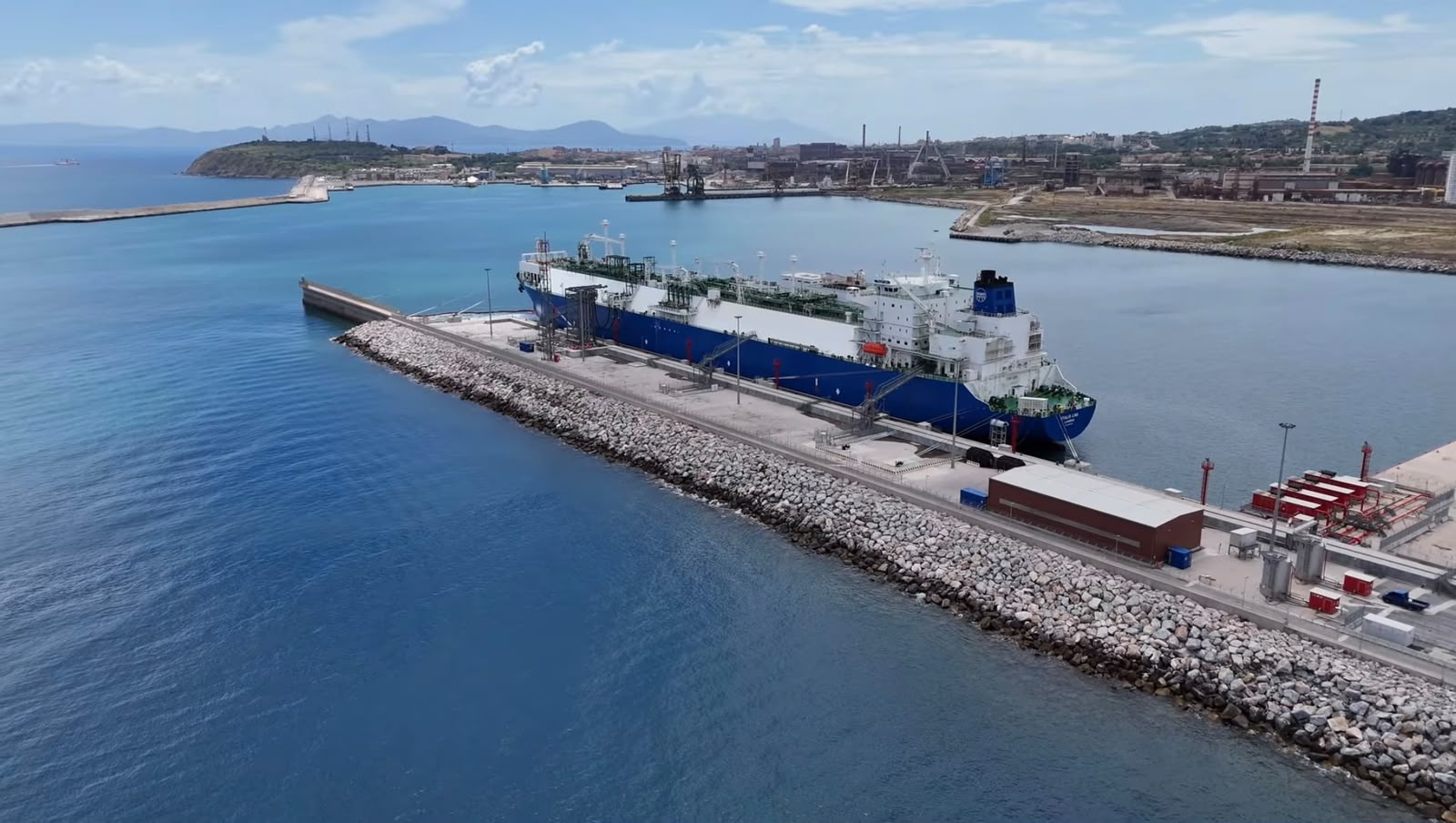 LNG terminal with docked vessel and port industrial infrastructure